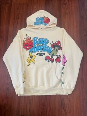 Cream "Keep Moving" Graphic Hoodie with Colorful Cartoon Print